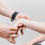 a couple of people that are holding hands